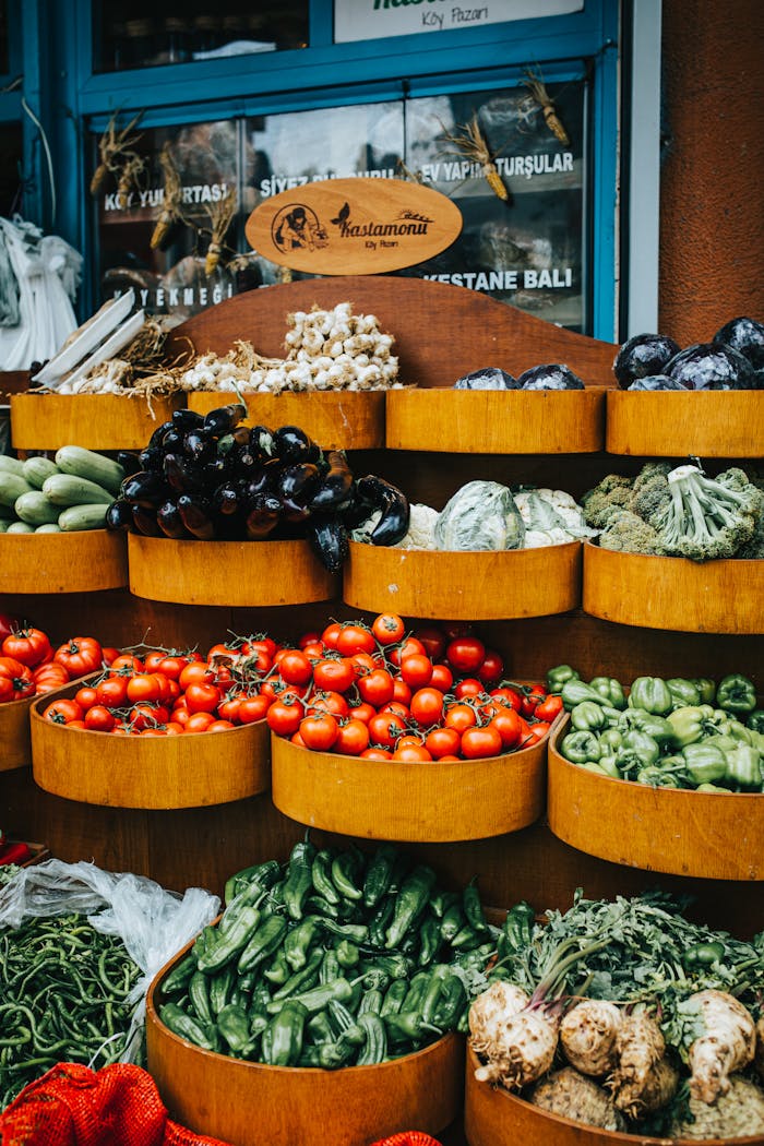 Colorful assortment of fresh vegetables at an outdoor market with a local artisan vibe.